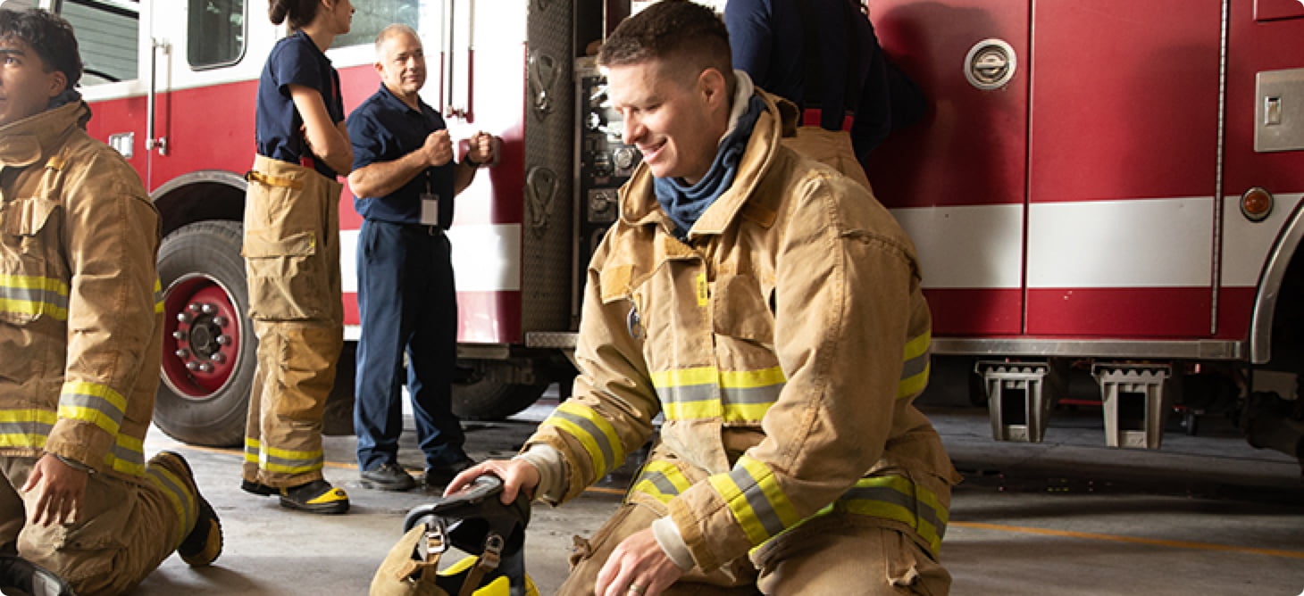 Zach in firefighter uniform.