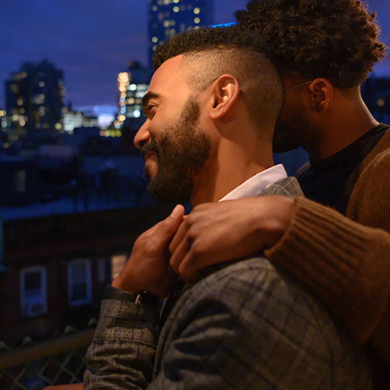 Dimitri leaning on partner and looking at the view.