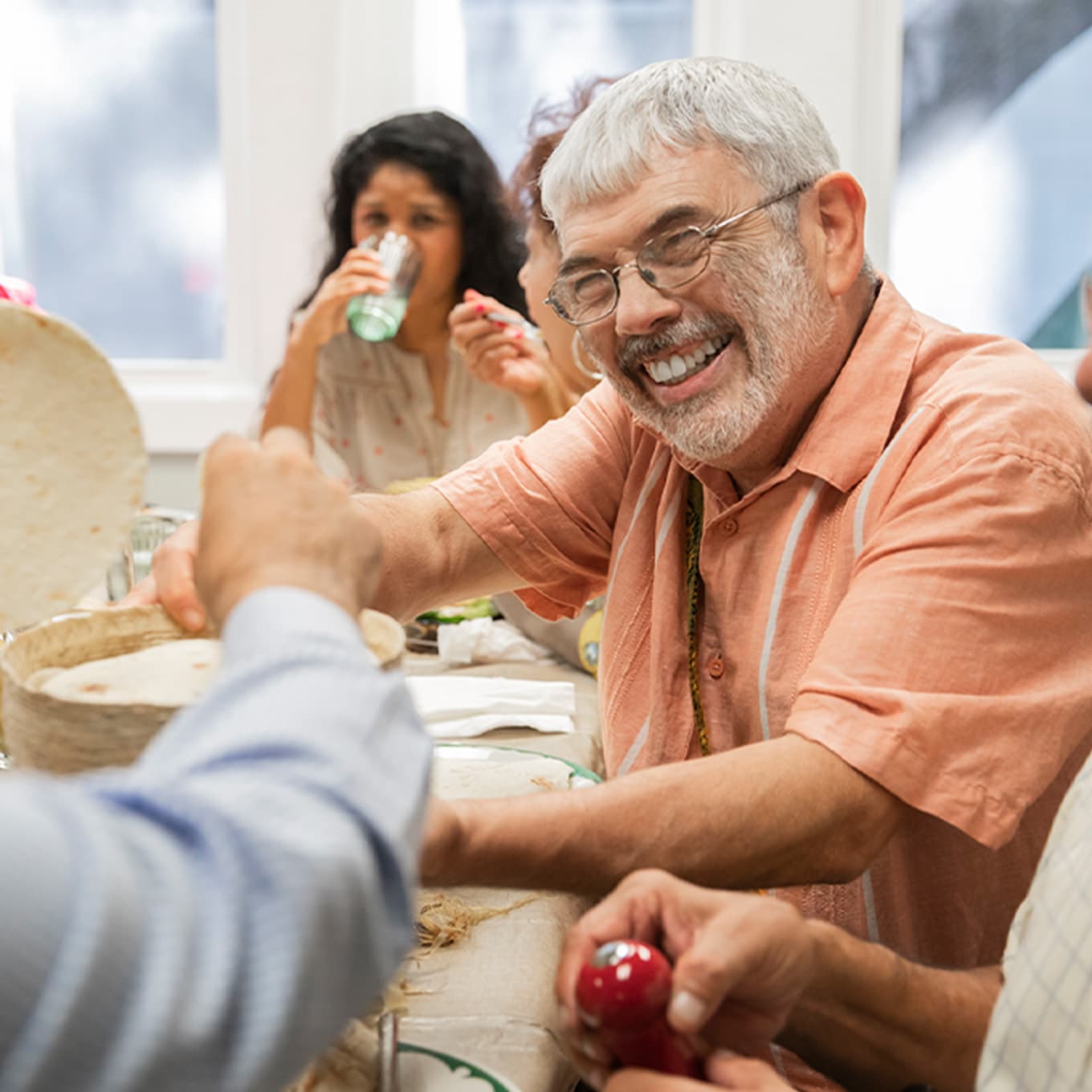 Hugo smiling at the dining table.
