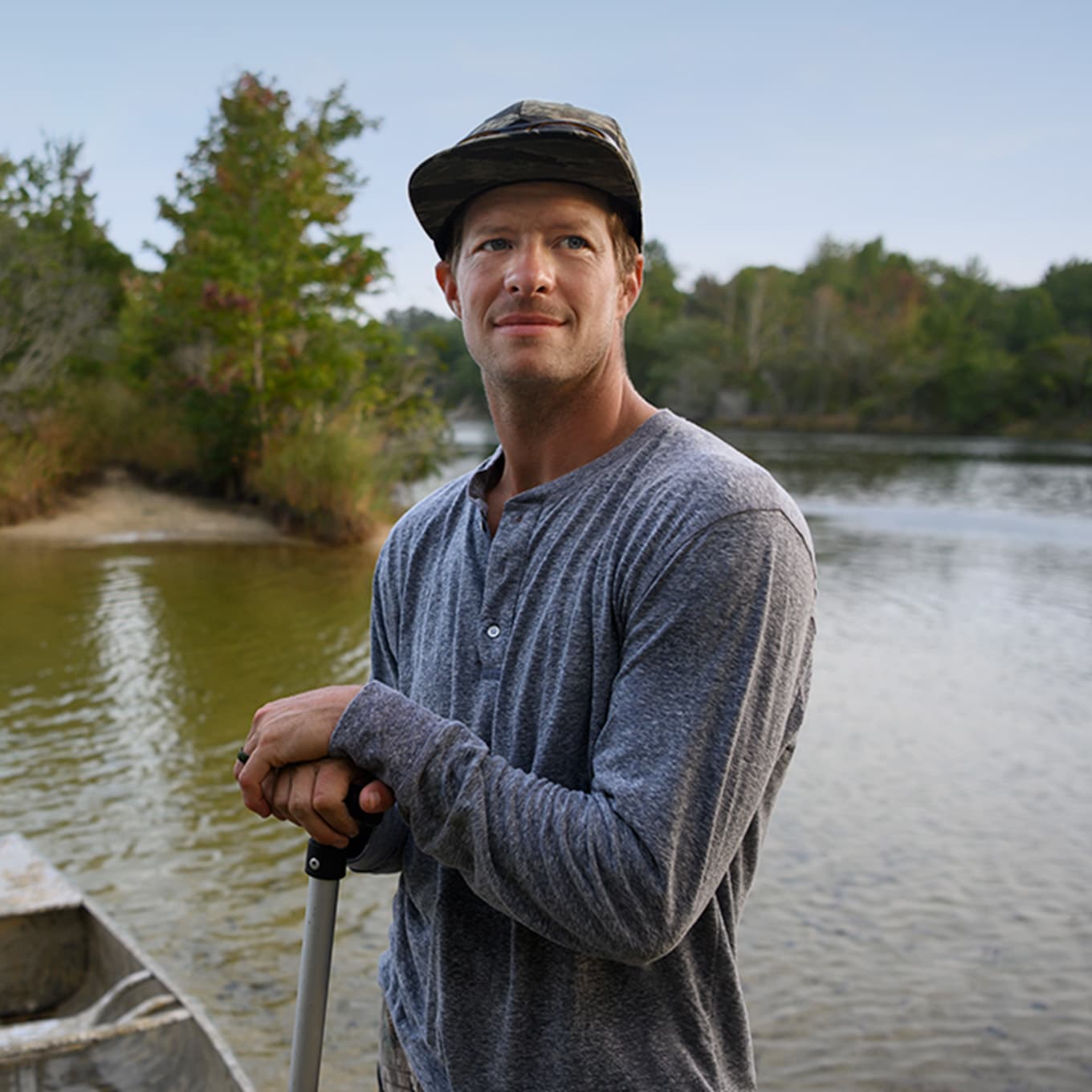 Zach is outside on a lake.