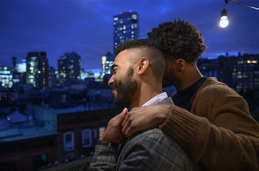 Dimitri leaning on partner and looking at the view.