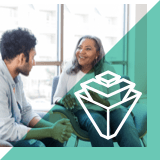 A woman looking at a man to her right.