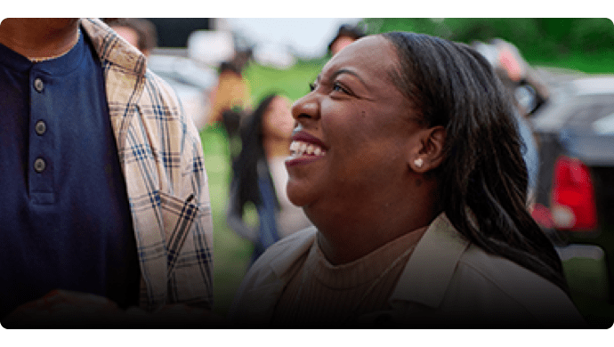 Tamera smiling up at someone.