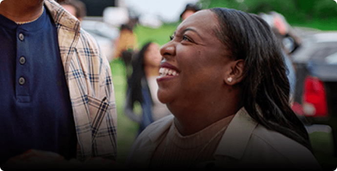 Tamera is smiling with a man.