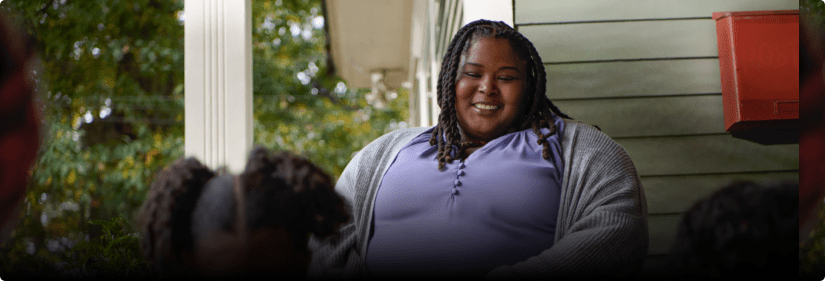 Nikki writing in a journal.