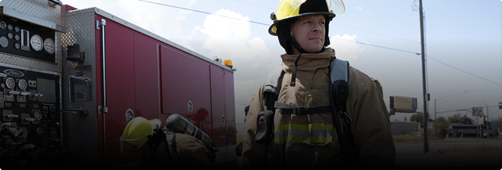 Zach wearing firefighter uniform.