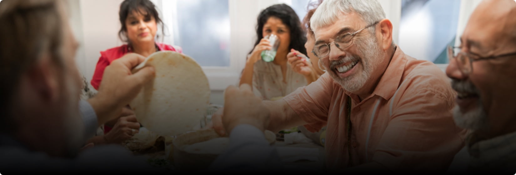 Hugo smiling with friends.