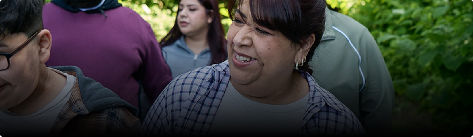 Maricela smiling with people.