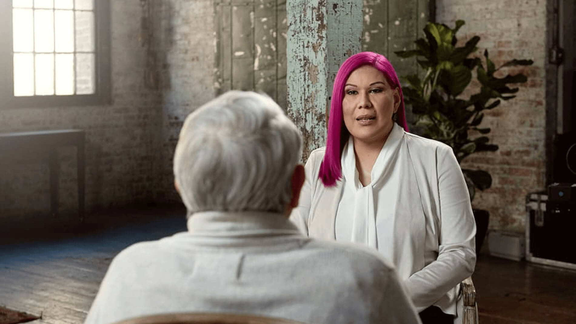 D’Eva and Hugo video play button.